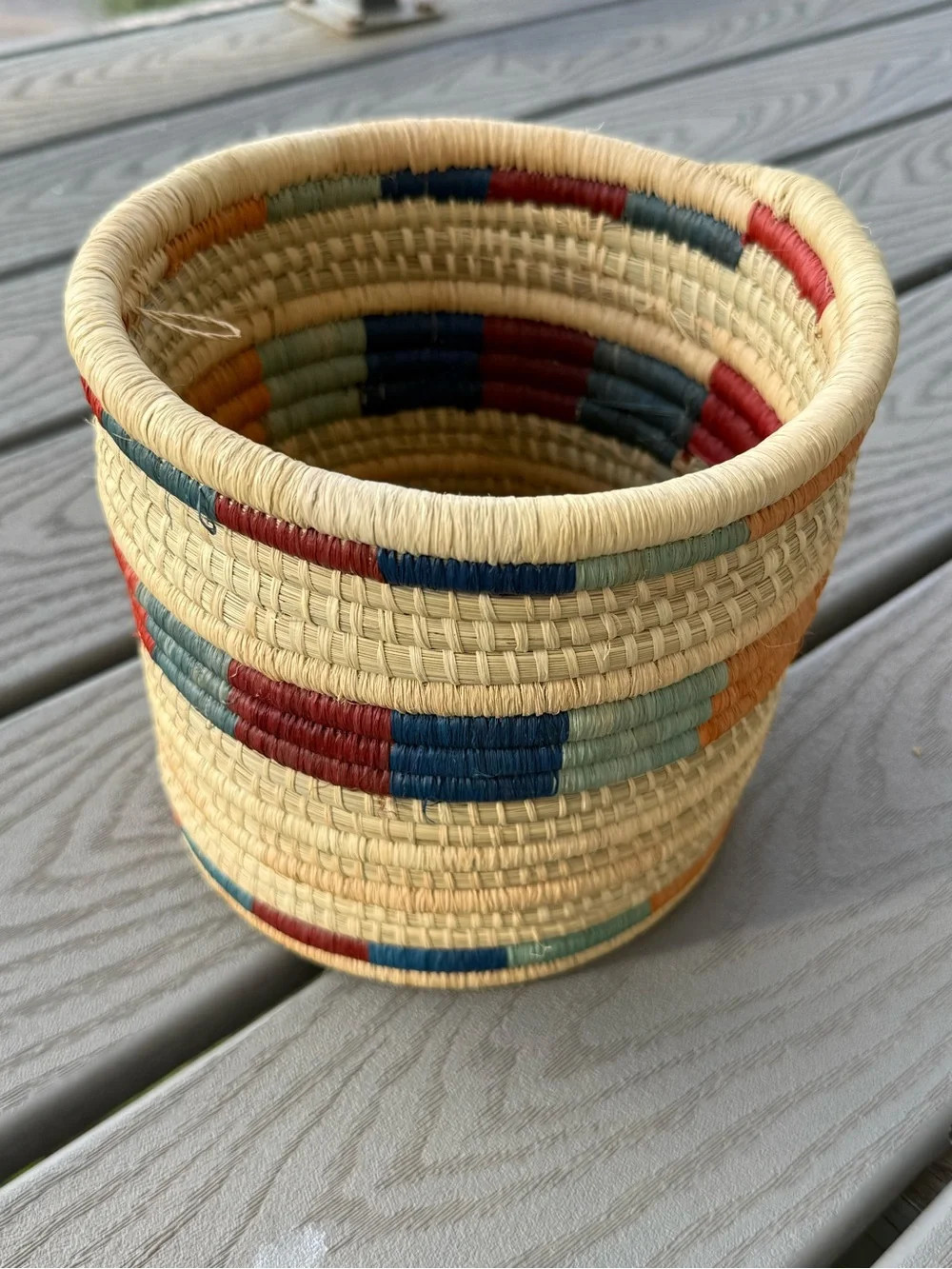 Handwoven Natural Basket with Red and Blue Accents